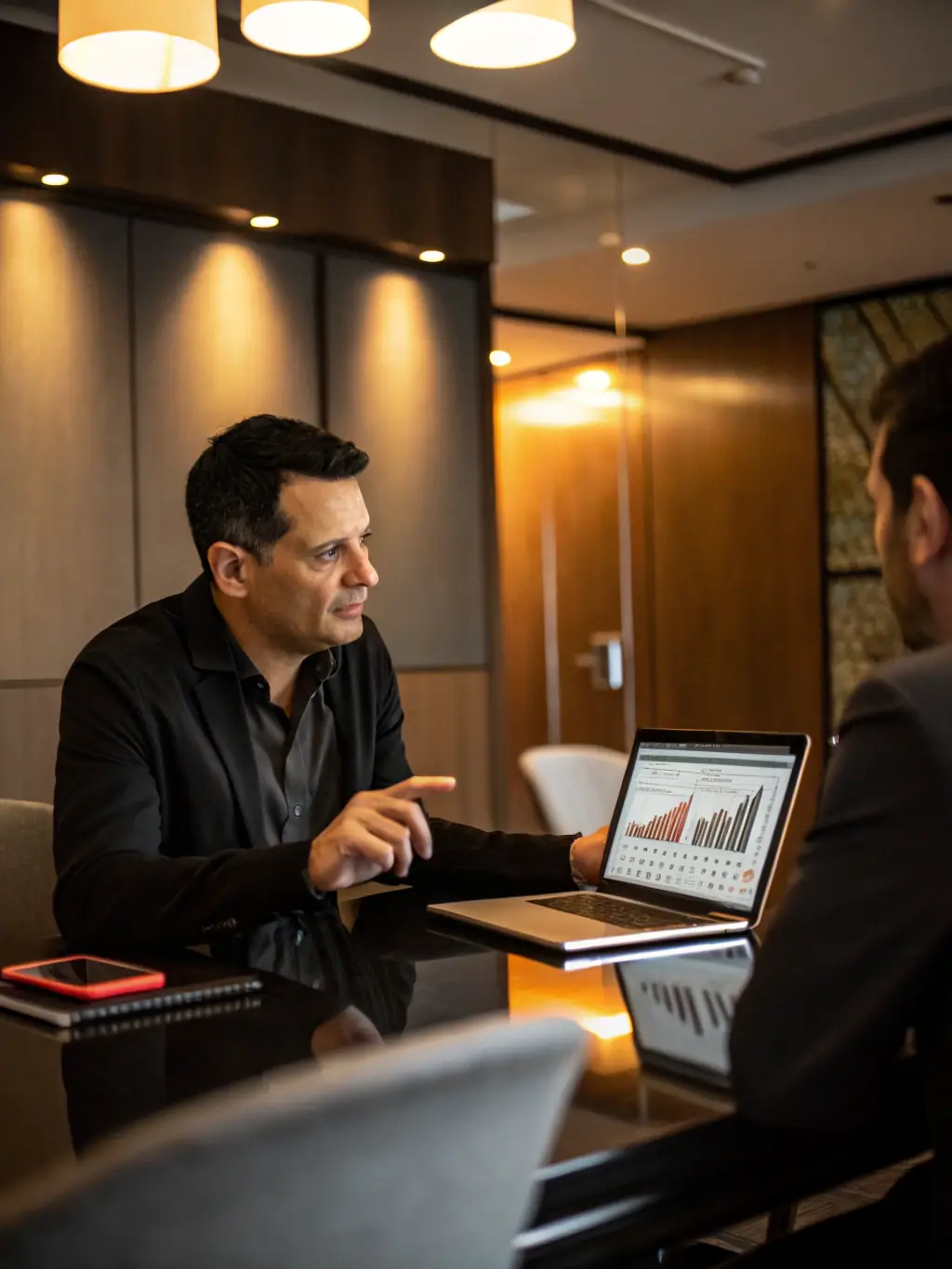A professional consultant advising a business owner in a modern office, emphasizing strategic planning and business growth.